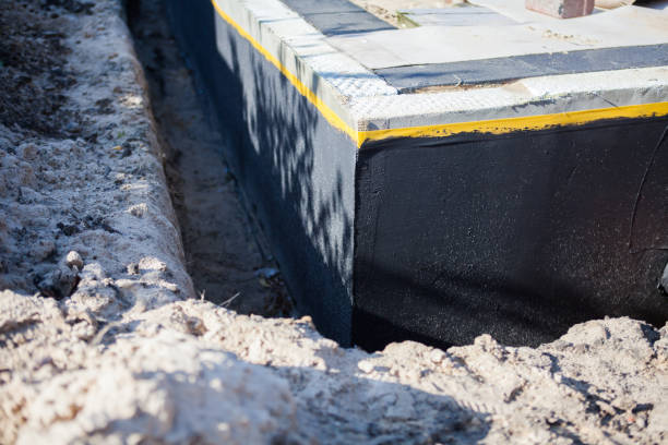 Professional Exterior Waterproofing technician working in Winona Lake, IN